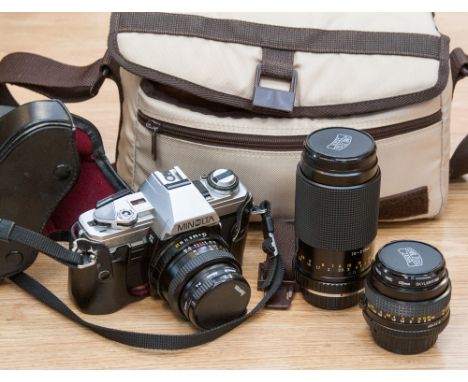 A Minolta camera and accessories