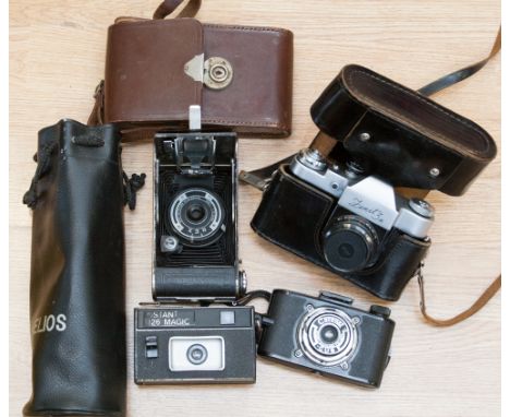 A Coronet camera; a Zenit camera, tripod 