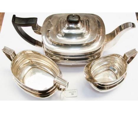 An early 20th Century three piece Regency boat shaped tea set, comprising, milk, twin handled sugar and ebony handled teapot,