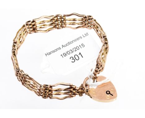A 9ct rose gold padlock gate bracelet 