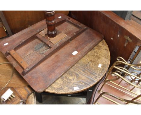 A 19th Century oak tilt top tripod table; together with a George III and later circular table, raised on a triangular frame (