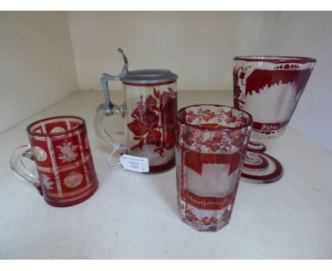Four items of ruby flared glass 