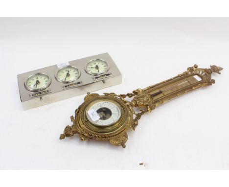 An early 20th Century barometer with Art Nouveau decoration; together with a multi time zone clock (2) 