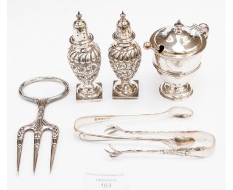 A pair of pepperettes of baluster form, leafage scroll embossed; together with a circular pedestal mustard, two pairs of suga
