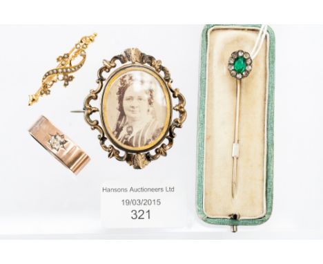 A cased paste stick pin, a 19th Century mourning brooch, a high carat seed pearl bar brooch and a paste set ring (4) 