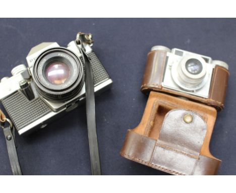 A collection of cameras including Praktica Super TL1000, Paxelle German camera, k tripod