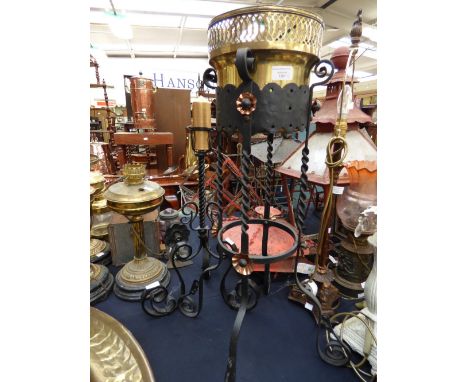 A gilt brass telescope; together with a brass jardiniere on cast iron stand and candle stick stand (3)  