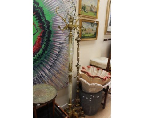 A French style gilt and onyx standard lamp, raised on a squared column, raised on four legs; together with a further gilt sta
