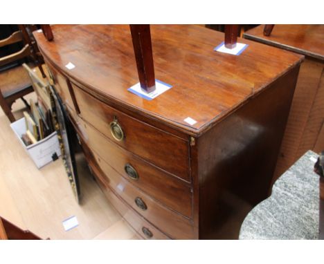 A George III mahogany bow - fronted chest of drawers, fitted with two short over three long graduated drawers, all retaining 