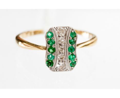 An Art Deco diamond and emerald ring on 18 carat gold band 