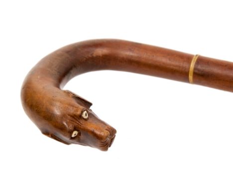 A treen dog's head walking stick, the carved head with hinged opening jaw