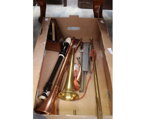 Two long coaching horns, another smaller, a metronome, a folding metal music stand and a tenor recorder