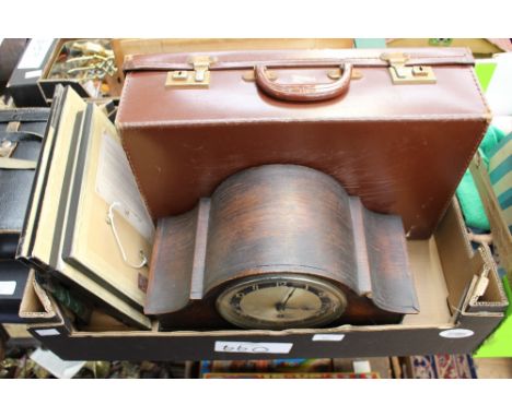 A box of assorted items, including a 1930s oak mantle clock, various pictures, photographs, mostly Victorian and a suitcase (