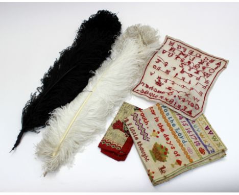 An early 20th Century wool sampler, worked by Lucy Richardson, aged 12 years, unframed; together with another sampler, worked