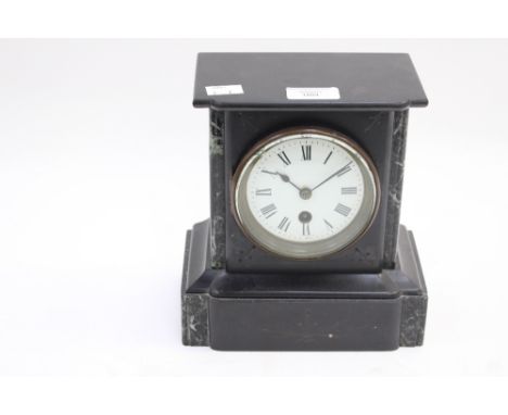 A late 19th Century French marble and slate mantle clock with white enamel dial and Roman numerals 