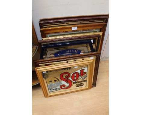 A collection of seven various pub advertising signs, comprising 'Beefeater', 'The Original Mackinley Sol', 'Guiness', 'Malt W