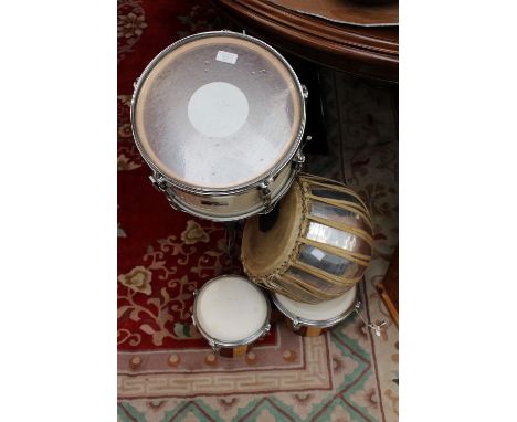 Snare drum on stand with a set of two bongo drums and an African drum and light up hand cymbals