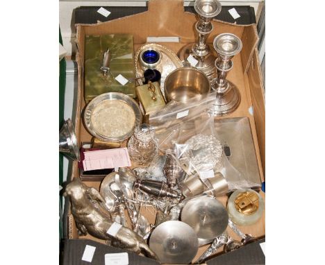 A small parcel of silver comprising two circular napkin rings, a pair of sugar tongs and a trinket box (on view in glass cabi