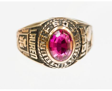 An American gold class ring, stamped 10k, Schaumburg C.S. set with a synthetic ruby, six grams approx 