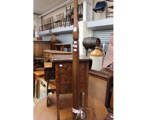 An Art Deco standard lamp, together with a small drop leaf side table, fitted with three drawers, (2)