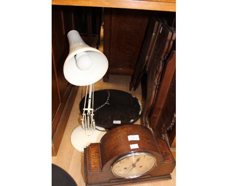 A 1920s oak Art Deco style mantel clock, Westminster Chime; together with a small circular wall mirror; a folding carved wood