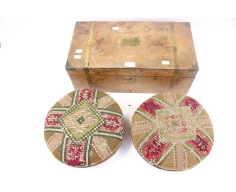 A pair of late Victorian circular oak footstools, tapestry tops; together with a Victorian walnut and brass bound writing slo