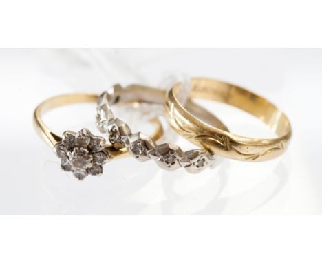 An 18 ct gold and diamond cluster ring, a 9 ct white gold and diamond ring, an 18 ct gold ring (3) 