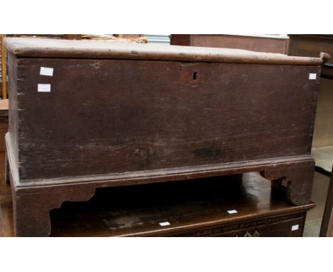 A George III oak blanket box raised on bracket feet 