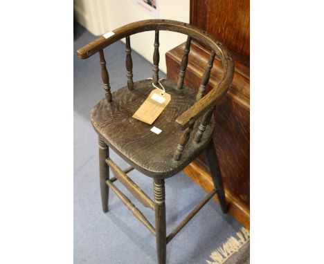 A 19th century Windsor child's elm and oak high chair, originally of comb-back form, the upper section of back now missing, h