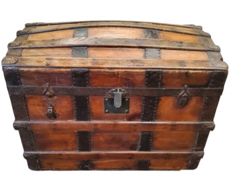 A metal bound domed top travel trunk, 60cm x 79cm x 46cm