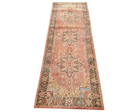 An Oriental Bakhtiari type runner in subtle terracotta colours, 240cm x 77cm