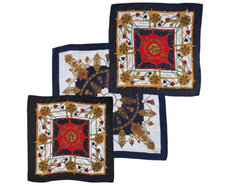 A vintage classic Hermes silk scarves,&nbsp; in tones of black, gold, green and red, black border, signed Hermes, Paris;&nbsp