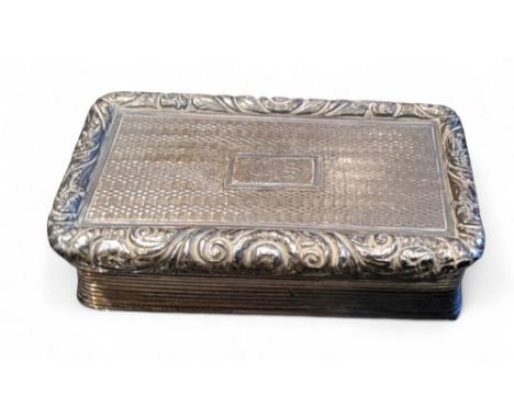 A George III silver rectangular snuff box, the cover with central cartouche, engraved in lines, foliate scroll border, gilt i