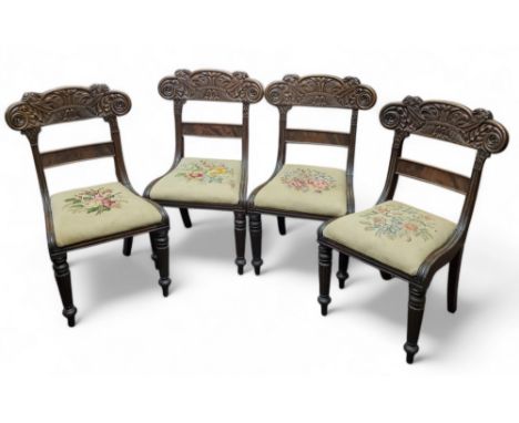 An unusual set of four William IV Anglo-Colonial dining chairs, carved with parrots and serpents to back rests, tapestry drop