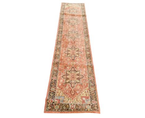 An Oriental runner, 350cm x 77cm, 20th century