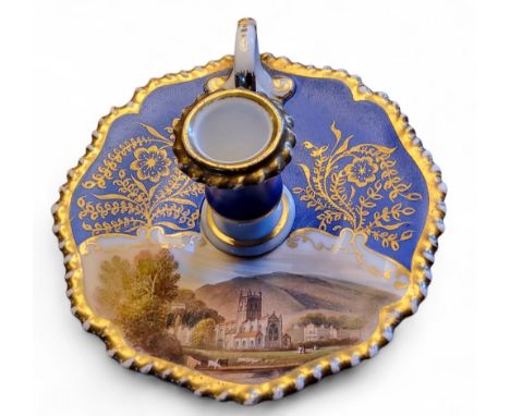 A Chamberlain’s Worcester Named View taper stick,&nbsp; painted with a view of Malvern, on a powder blue ground, gilt gadroon