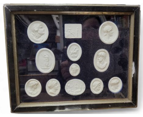 An arrangement of plaster intaglio impressions, various Grand Tour and historical subjects, 17.5cm x 23cm