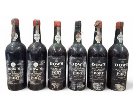 A Dow's 1961 Late Bottled Vintage Port, bottled 1965; another; four bottles of Dow's 1964 Late Bottled Vintage Port, bottled 