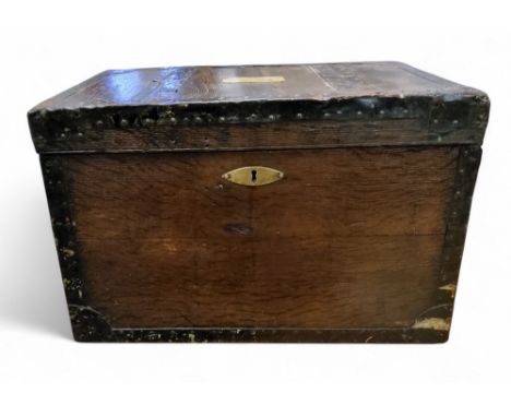 A 19th century metal bound military travel trunk, brass cartouche inscribed Capt W H Young, 16th Regt, 33.5cm high, 52cm wide