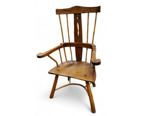 A 19th century rustic yew and beech stick back Windsor chair, scroll arms, crinoline stretcher, 101cm high, 51cm wide, c.1850