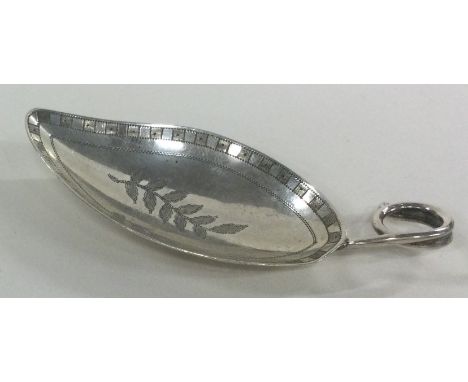 A George III leaf shaped silver caddy spoon with bright cut decoration. London 1812. By Edward Mayfield. Approx. 11 grams. Es