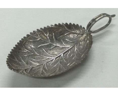 A George III silver leaf shaped caddy spoon. Birmingham. Marked to handle. Approx. 7 grams. Est. £80 - £120.