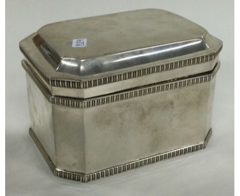 A large silver tea caddy with hinged lid. London 1925. By William Bruford & Son. Approx. 433 grams. Est. £300 - £400.