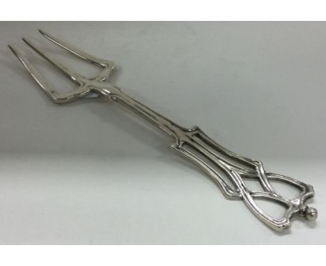 A large silver toasting fork in the Ramsden style. London 1910. By Nelson Dawson. Approx. 105 grams. Est. £200 - £300.