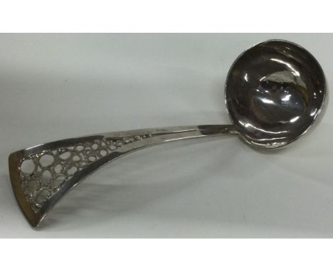 An extra large silver sauce ladle with pierced handle. 1983. By Graham Watling. Approx. 140 grams. Est. £120 - £150.