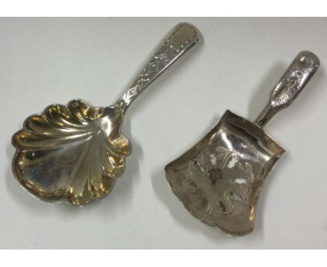 Two silver caddy spoons. London by HG and Birmingham 1814 by IT. Approx. 24 grams. Est. £30 - £40.