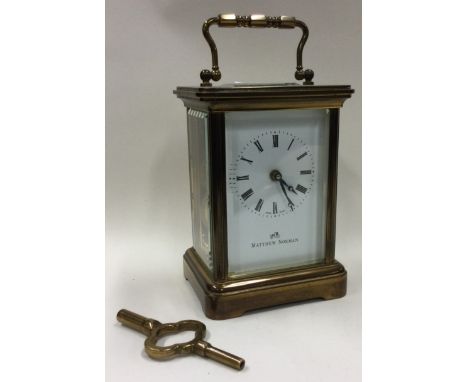 A brass carriage clock with white enamelled dial. Est. £30 - £50.