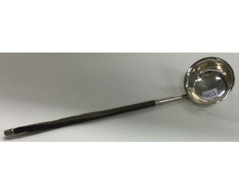 A Georgian silver toddy ladle. Approx. 11 grams. Est. £30 - £50. 