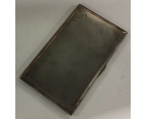 A heavy engine turned silver cigarette case. London. Approx. 219 grams. Est. £80 - £120.