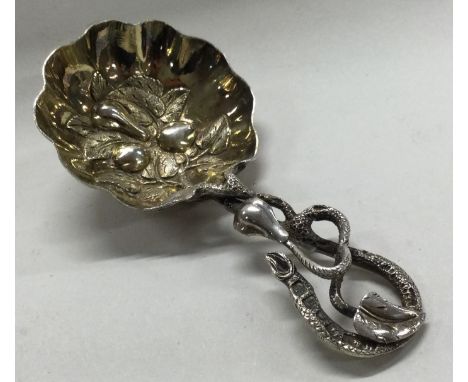 A Victorian silver caddy spoon with snake handle and chased decoration. Birmingham 1852. By Hilliard & Thomason. Approx. 12 g